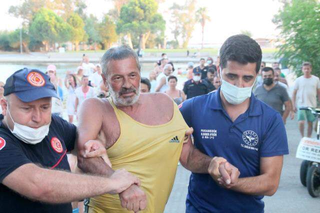 İnatçı Rus turist yüzmenin yasak olduğu gölden güçlükle çıkartıldı