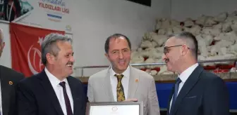 MHP'den yeniden seçilen Mustafa Koloğlu mazbatasını alarak göreve başladı