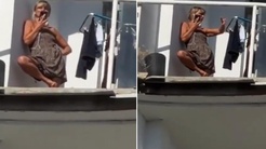 Bina bombaların hedefi oldu, genç kadın hiçbir şey olmamış gibi davrandı