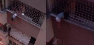 Balkonda asılı kalan çocuğu itfaiye kurtardı