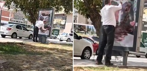Reklam panosundaki afişi sprey boya ile kapattı Gerekçesi de olay kadar ilginç
