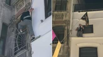  Leman protestoları sırasında binaya tırmanıp Tevhit bayrağı astı