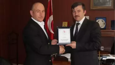 G.H.S.İ.M'den Plaket Takdimi