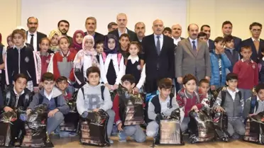 Genç'te Bin Öğrenciye Bot ve Mont Dağıtıldı