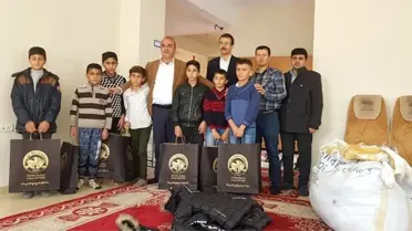 Başkan Benek'ten öğrencilere kışlık bot ve mont yardımı