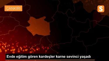 Evde eğitim gören kardeşler karne sevinci yaşadı
