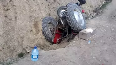 Devrilen traktörün altında kalan 2 kişi yaralandı