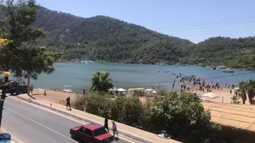 Marmaris'in önemli turizm bölgelerinden Kızkumu Plajı'nda hayat normale dönmeye başladı