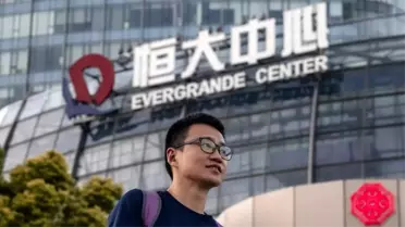 Evergrande: Çin'in emlak devinin hisseleri borç faizini ödediği haberi sonrası yükseldi