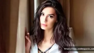 Sinan Akçıl ile boşanmanın eşiğinde olan Burcu Kıratlı dekolteli kıyafetiyle olay yarattı