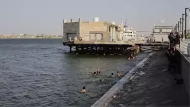 Aşırı sıcaklara sahne olan Basra'da uzun süreli elektrik kesintileri yaşanıyor