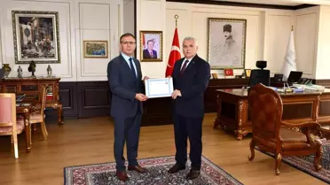 Vali Yıldırım'dan Kaymakam Sarılı'ya başarı belgesi