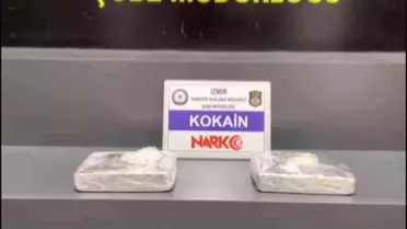 İzmir'e yolcu otobüsü ile 2 kilogram kokain getiren zehir taciri kadın yakayı ele verdi