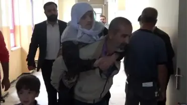 Parkinson hastası Dilber Tunç, oğlunun sırtında oy kullanarak seçim görevini yerine getirdi
