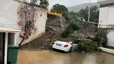 Bodrum'da Duvardan Yangın: Oto Hasarı ve Mahsur Kişi Kurtarıldı