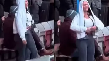 Kadın taraftar, kendisine küfreden rakip takım taraftarlarına göğüslerini göstererek karşılık verdi