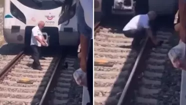 Raylara düşen kediyi kurtarmak için treni durdurdu, raylara indi