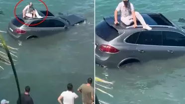  Denize uçan lüks cipin üzerinde dakikalarca kurtarılmayı bekledi