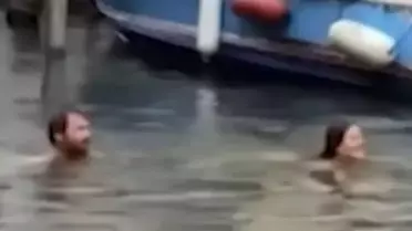 Yasağa rağmen suya atlayan turist çift, şehirden kovuldu