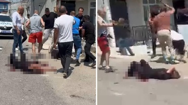 Eşini sokak ortasında bıçaklayarak öldüren adama linç girişimi