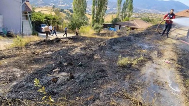 Kütahya Emet'te otluk alanda çıkan yangın itfaiyenin erken müdahalesiyle söndürüldü