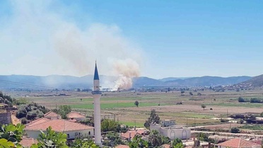 Muğla Milas Yaşyer'de sazlık ve otluk alanda çıkan yangın kontrol altına alındı