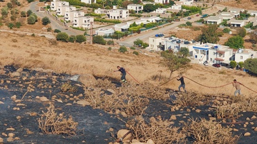 Bodrum Karaincir'de makilik alanda çıkan yangın itfaiye ekiplerince söndürüldü