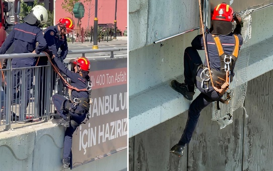 İtfaiye eri, Arnavutköy'de köprüdeki panoda mahsur kalan yavru kediyi kurtardı