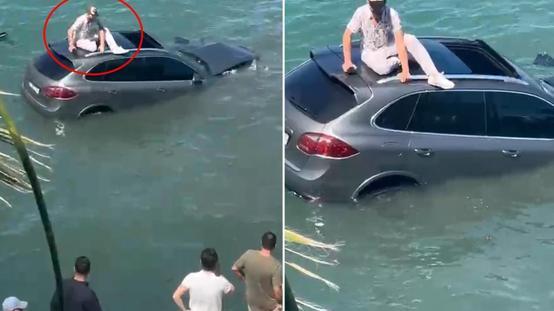  Denize uçan lüks cipin üzerinde dakikalarca kurtarılmayı bekledi