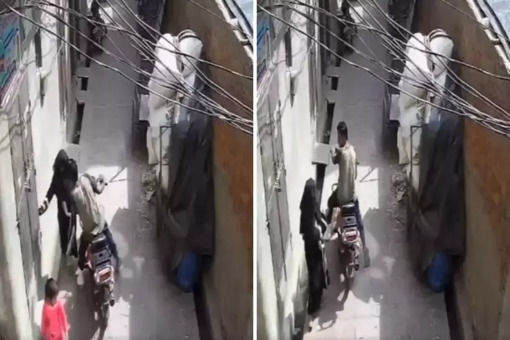 Motosikletli genç, sokakta sıkıştırdığı kadını zorla öptü