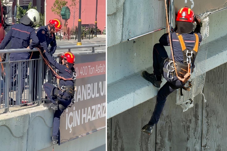 İtfaiye eri, Arnavutköy'de köprüdeki panoda mahsur kalan yavru kediyi kurtardı