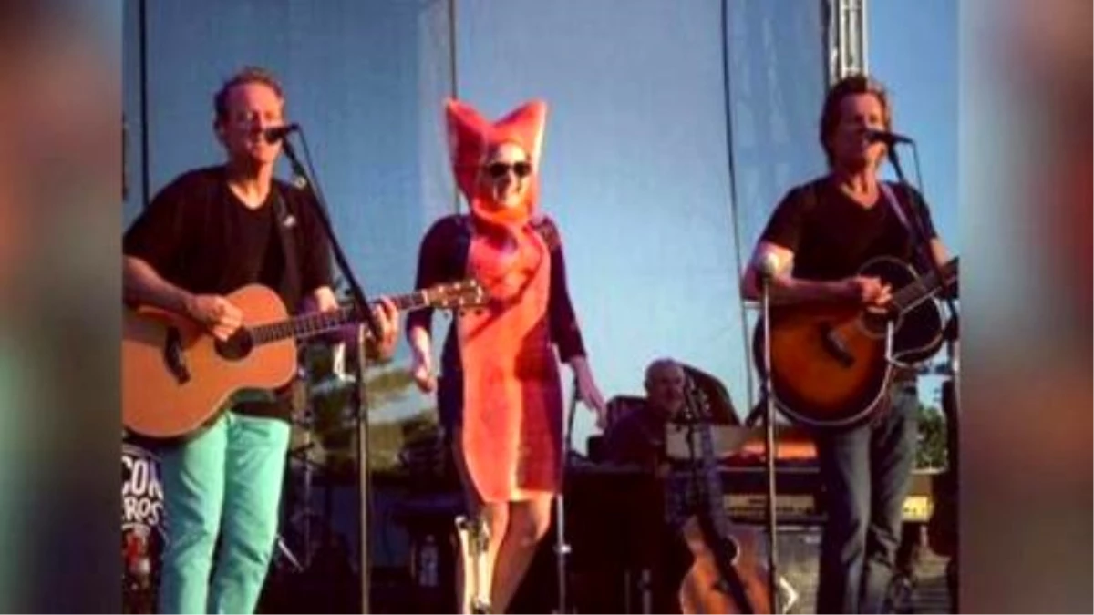 Kevin Bacon Dances On Stage With Bacon Strip During Concert