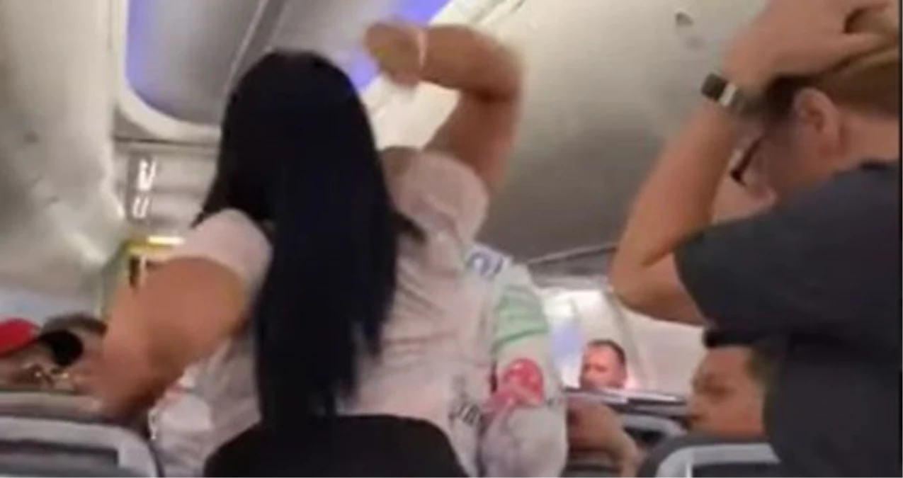 Uçakta başkasına baktığını farkeden kadın, sevgilisinin kafasında laptop parçaladı