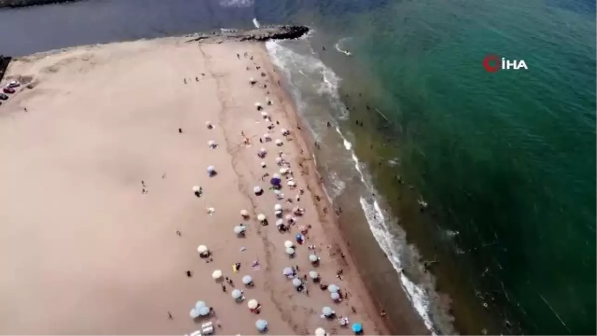 Nemden bunalan İstanbulluların akın ettiği Riva Plajı havadan görüntülendi- Vatandaşlar denizin...