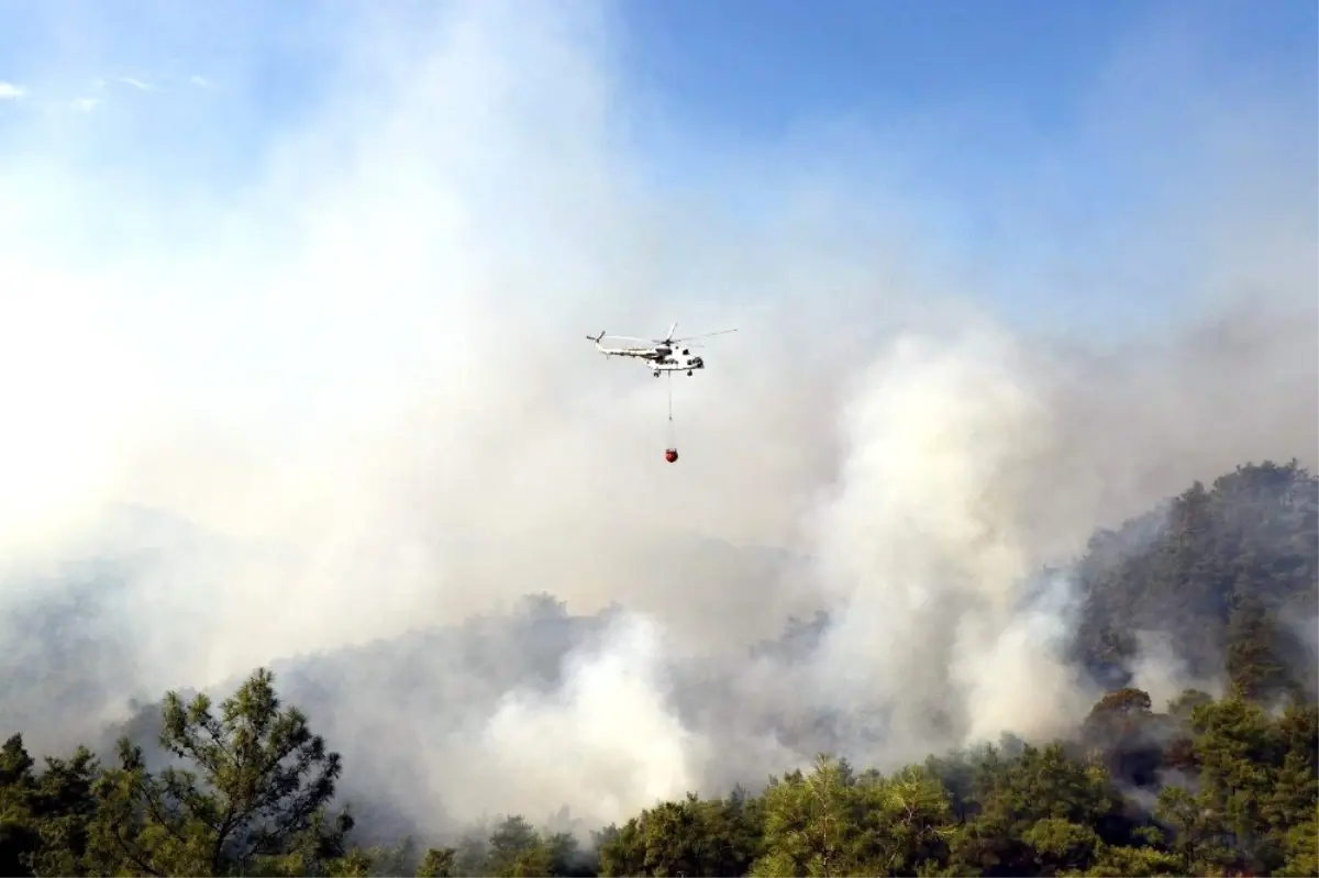 Muğla\'daki yangına 10 helikopterle müdahale sürüyor