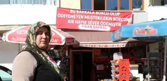 Veresiye defterindeki borçları kapattı, 'Borcunuz ödendi pankartı' astırdı