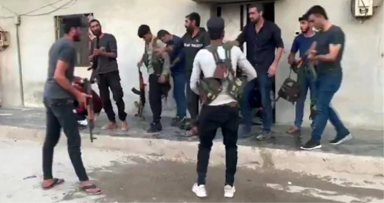Suriye\'de YPG\'li teröristlerin sivil kıyafet oyunu kameraya yansıdı