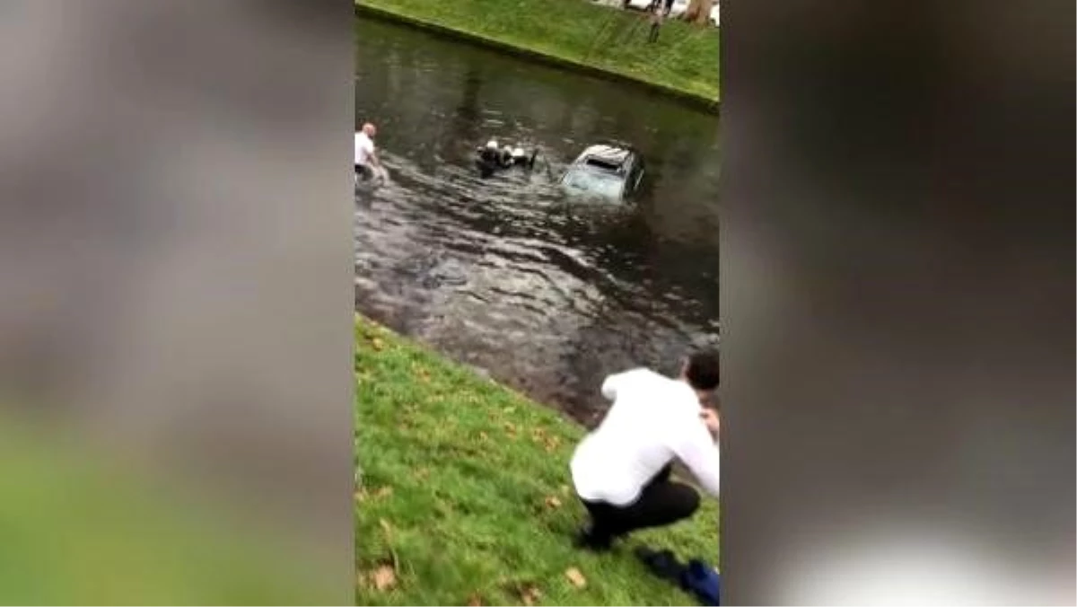 Almanya\'da bir Türk, araçlarıyla kanala düşen çifti kurtardı