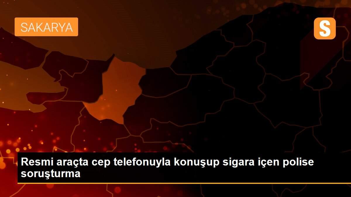 Resmi araçta cep telefonuyla konuşup sigara içen polise soruşturma