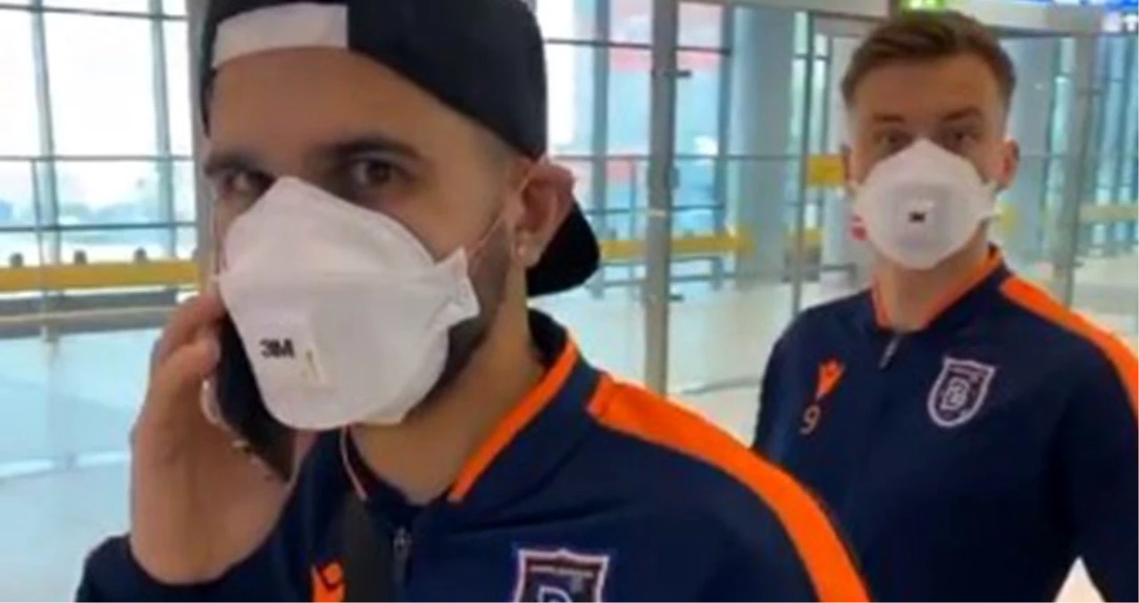 Başakşehirli futbolcular, koronavirüsten riski nedeniyle havaalanında maske taktılar