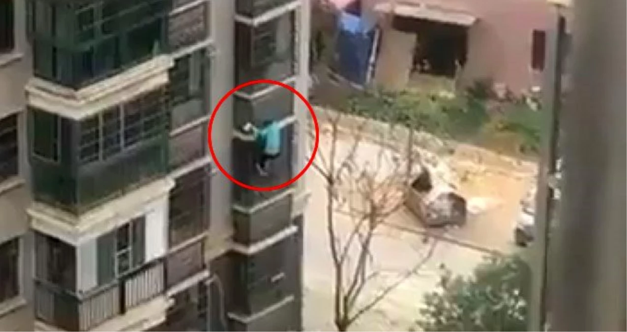 Çin\'de virüs sebebiyle karantina altına alınan adam binanın kolonlarına tutunarak kaçtı
