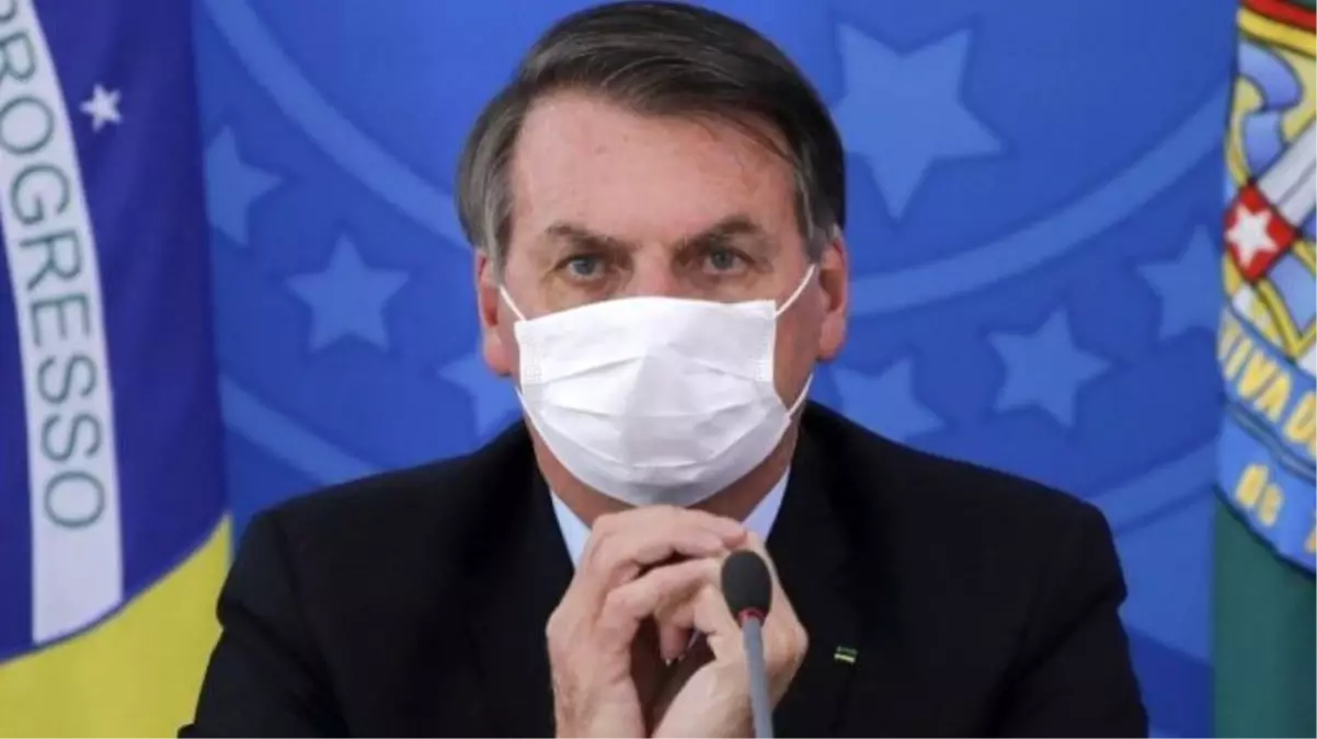 Brezilya Devlet Başkanı Bolsonaro, maske takıp koronavirüs için "Basit bir grip" dedi