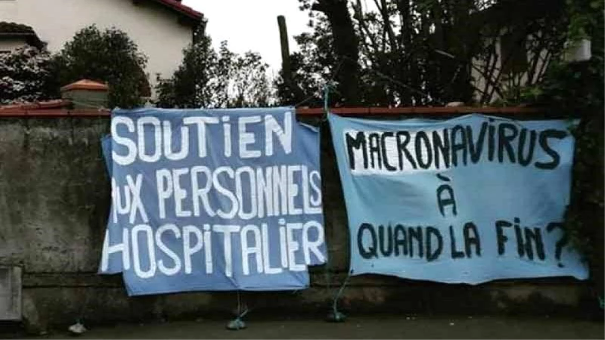 Fransa\'da "Macronavirüs" yazılı pankart asan genç kadın dört saat gözaltında tutuldu