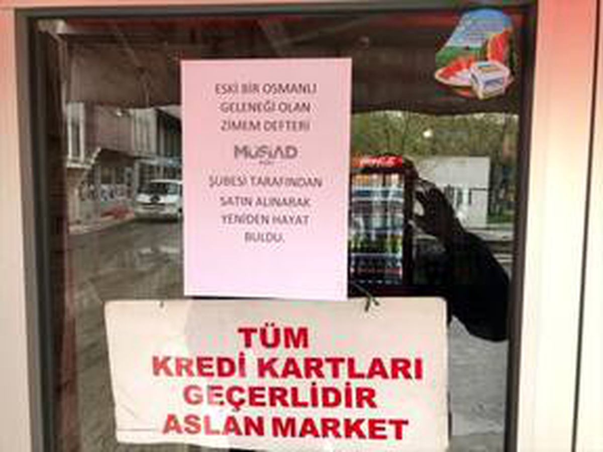 MÜSİAD Ağrı Şubesi ihtiyaç sahiplerinin veresiye defterlerindeki borçlarını ödedi
