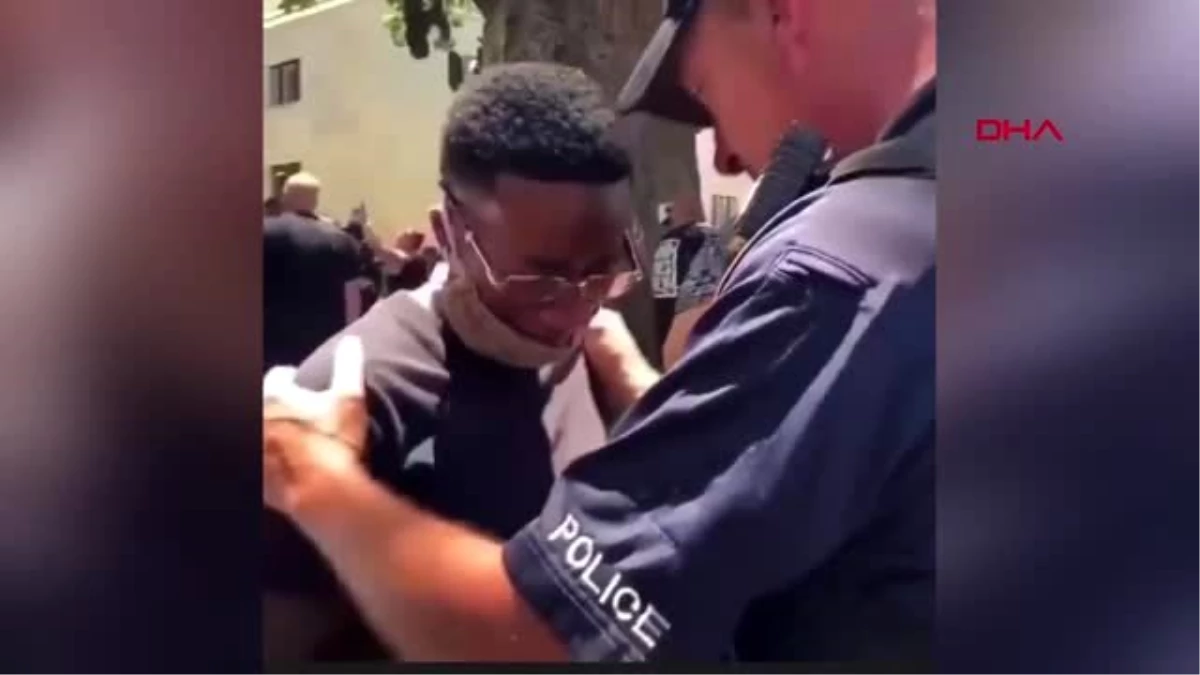 ABD\'deki protestolarda ağlayan eylemciyi polisin teselli etmesi kamerada