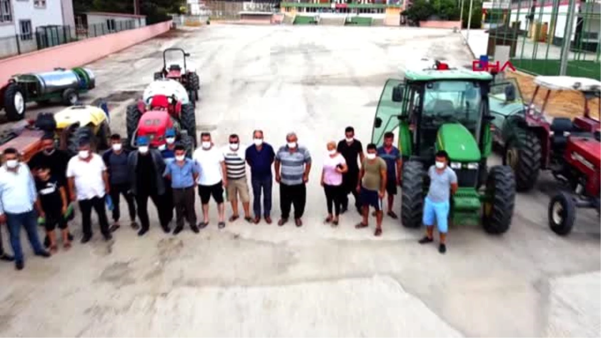 ADANA Kozan\'da köylüler traktörlerle ilçeyi dezenfekte etti