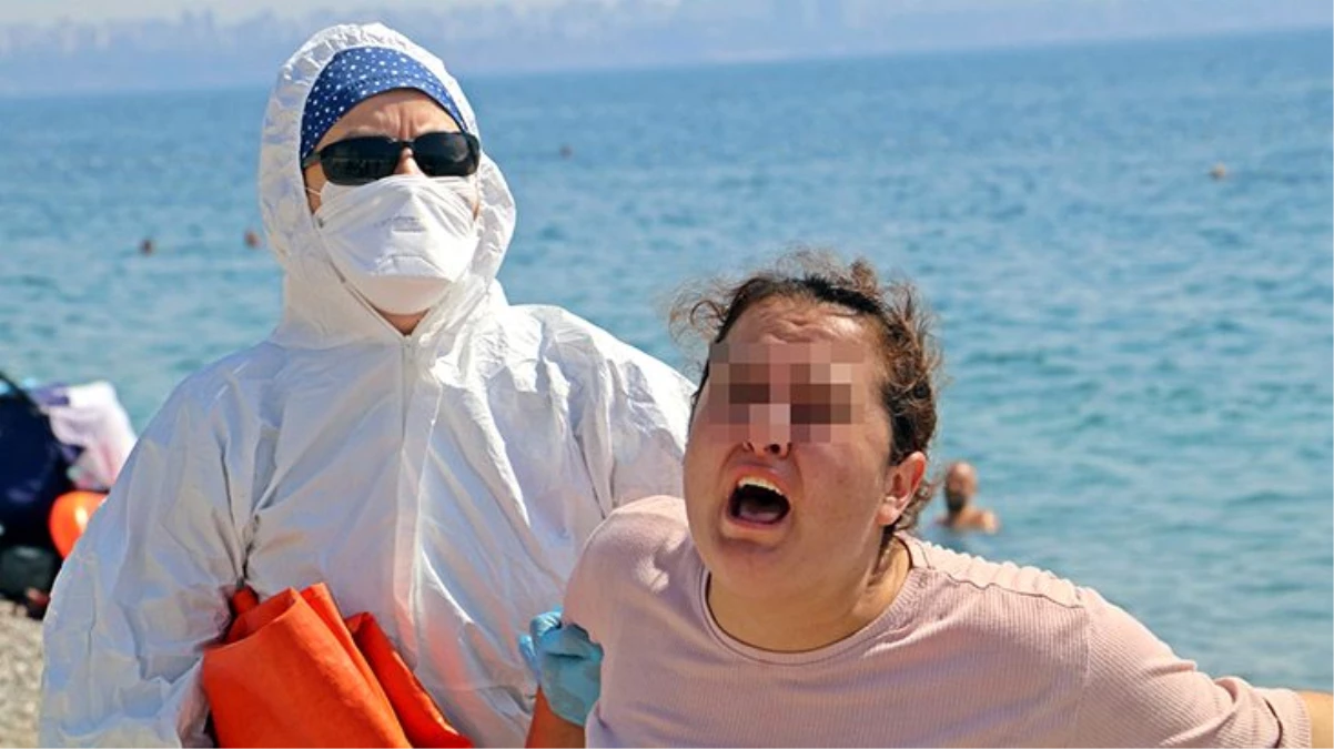 Karantinayı delip sahile giden koronavirüslü kadın, "Ölmek istemiyorum" diye bağırıp etrafa tükürdü