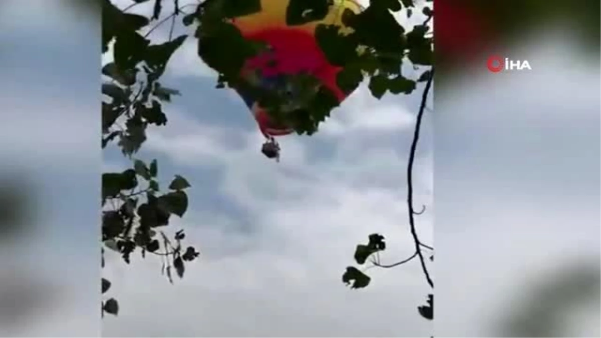 Çin\'de sıcak hava balonunun sepetine asılı kalan çalışan metrelerce yüksekten yere çakıldı