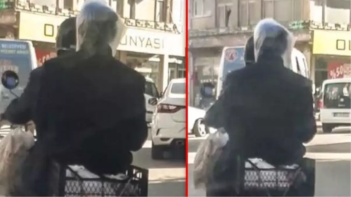 Motosikletlinin arkasındaki şahıs, başına geçirdiği poşetle koronavirüse karşı önlem aldı