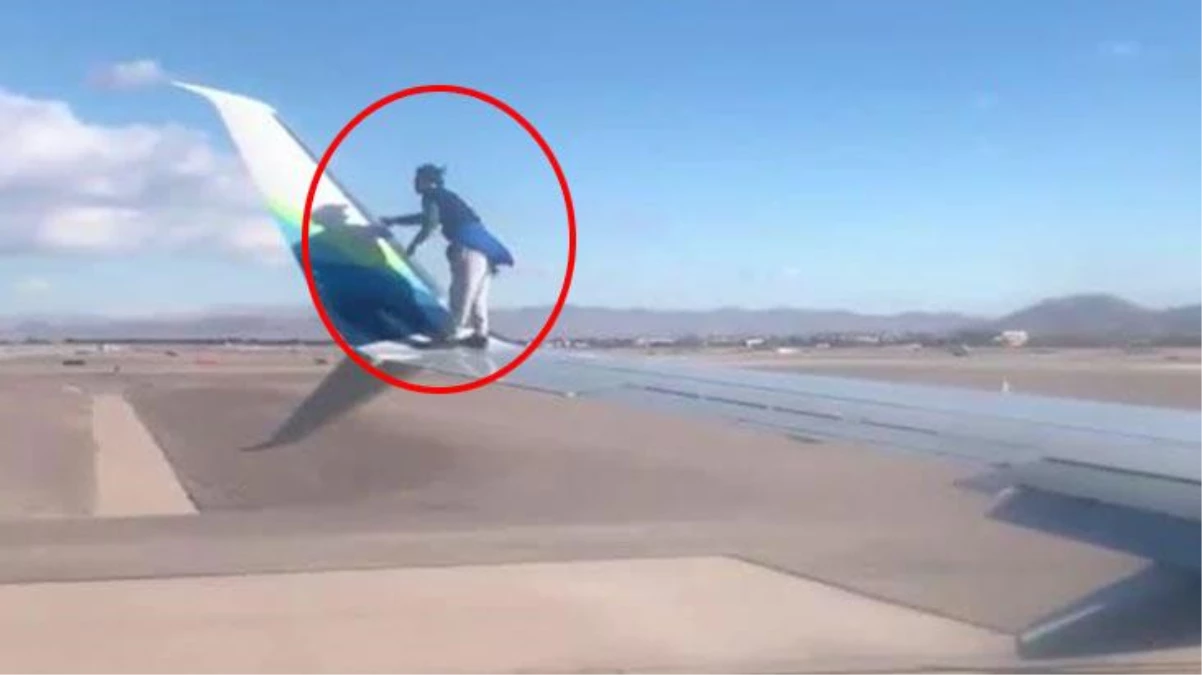 ABD\'de bir kişi, kalkış yapmaya hazırlanan uçağın kanadına tırmandı